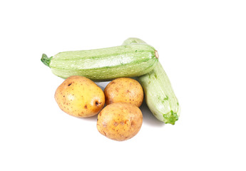 a group of fresh vegetables - potatoes and marrow