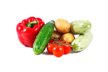 a group of fresh vegetables isolated over white background