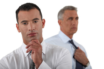 Two businessmen preparing to give important presentation