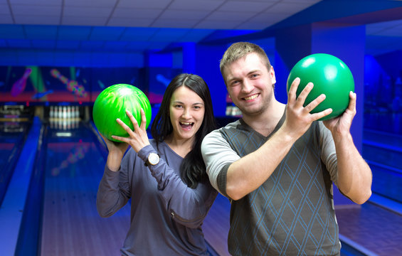 Happy couple in a bowling