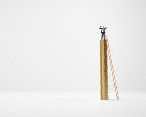 successful businessman standing on column of gold coins