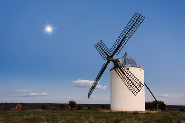 Plakat Typical windmill in with the moon at the background