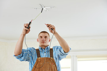 Electrician at wiring work