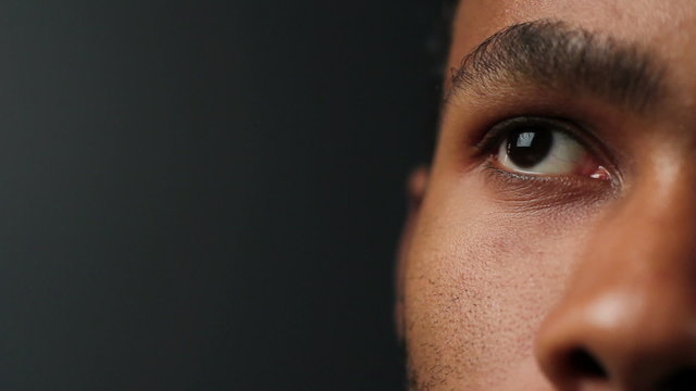Close up of African American man's eyes, looking up