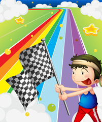 A boy holding a racing flag in the racing field