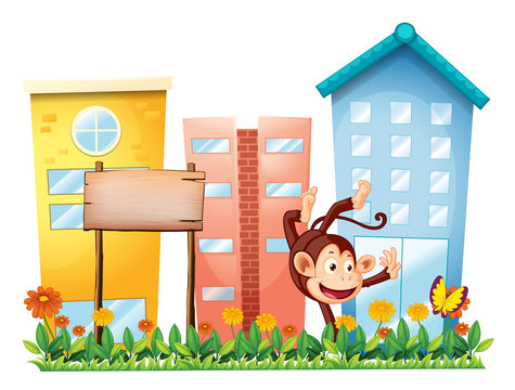 A monkey in the garden with a wooden signboard