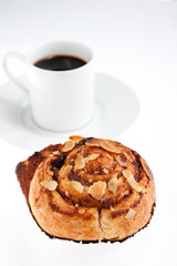 cinnamon rolls with hot coffee on white background