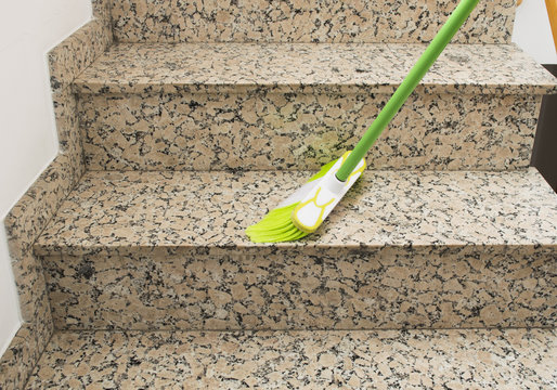 brush cleaning the stairs marble