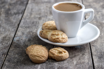 coffee cup and cookies  on table