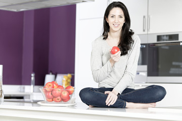 Woman holding an apple