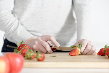 Woman cutting up fruit