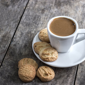 coffee cup and cookies  on table