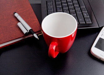 cup of coffee and business objects on the table