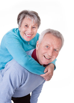 Senior Couple Enjoying Piggyback Ride