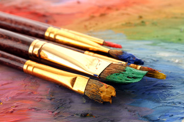 Obraz premium acrylic paint and brushes on wooden palette