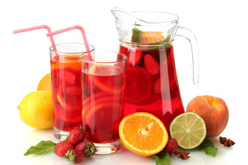 sangria in jar and glasses with fruits, isolated on white