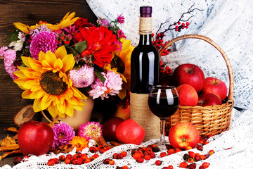 Colorful autumn still life with apples and and wine close-up