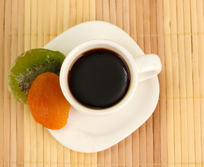 Cup of coffee on brown background