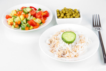Healthy food on plate isolated on white