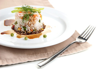 Delicious risotto with vegetables isolated on white