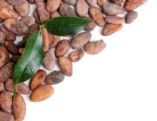 Cocoa beans with leaves isolated on white