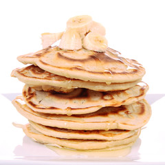 Pancakes with bananas and syrop
