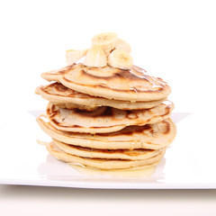 Pancakes with bananas and syrop