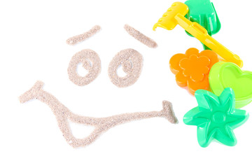 Children's toys on sand isolated on white