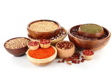 Different kinds of beans in bowls isolated on white