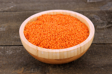 Beans in bowl on wooden background