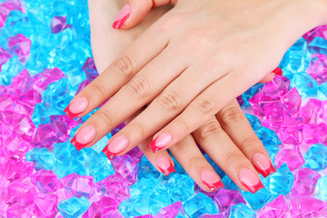 Closeup of hands of young woman with elegance manicure