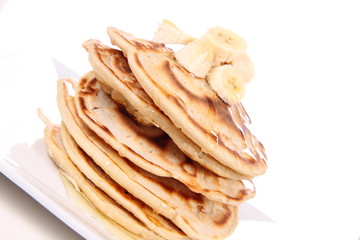 Pancakes with bananas and syrop