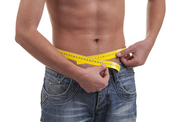 man measuring his waist