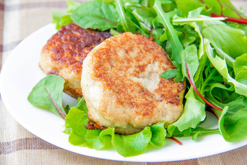 Fried meat rissoles with salad of lettuce for hamburger