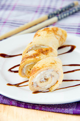 Omelet stuffed with cream cheese and rolled with chopsticks