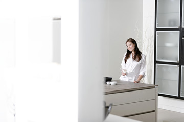 Woman in her stylish kitchen