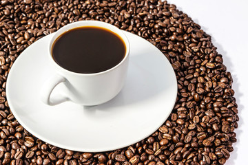 Coffee beans and coffee cup