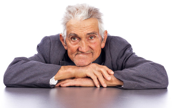 Portrait of a smiling old man looking at camera