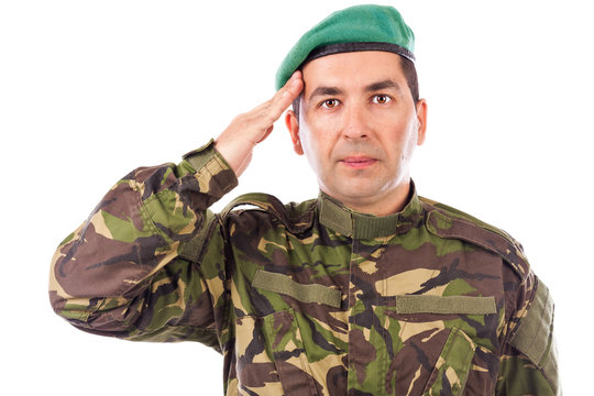 Young army soldier saluting isolated