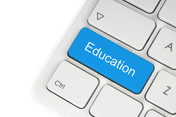 Blue education button on keyboard on white background.