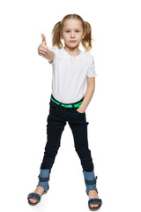 Little girl in full length making thumb up gesture