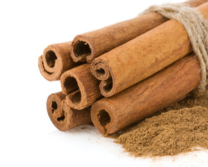 cinnamon sticks and powder on white