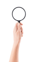 Hand holding a magnifying glass