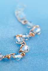 Golden jewelry bracelet with blue topaz