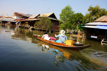 Obraz premium Traditional transportation, wooden boat in canal, Thailand.