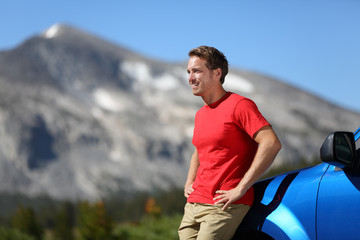 Car and driver man in beautiful mountain landscape