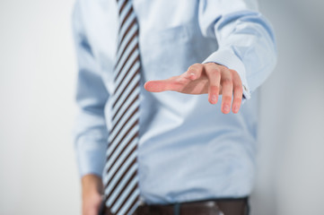 Young unrecognizable business man touching virtual button. Edita © Milles Studio