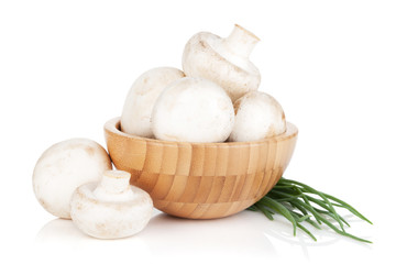 Bowl with champignon mushrooms and green onion