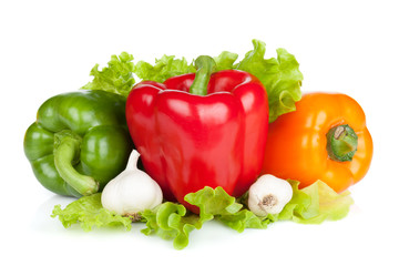 Colorful bell peppers with garlic and lettuce