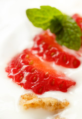 Strawberry pieces with cereals in yogurt